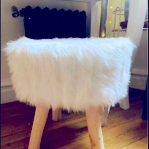 Brand new UGG fluffy stool, never used, 12” with 3 light wooden legs.